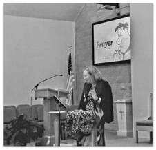 Picture of Pastor Sara preaching